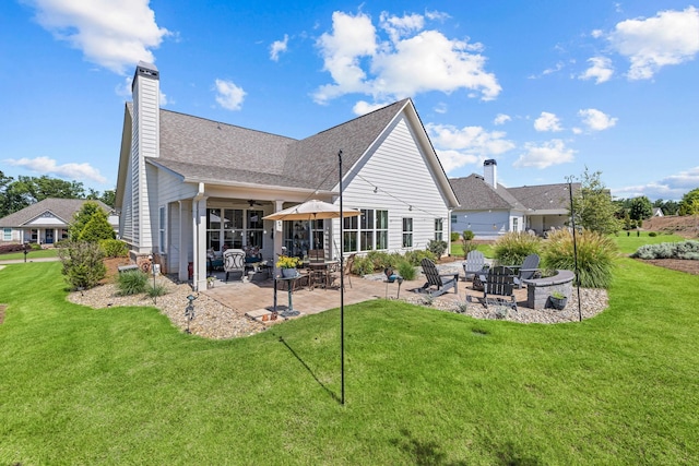1181 Hidden Hills Cir, Greensboro, GA 30642 - rear view of property with a patio area, a fire pit, a yard, ceiling fan, and a chimney