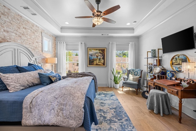 1181 Hidden Hills Cir, Greensboro, GA 30642 - bedroom with a raised ceiling, light wood-type flooring, ceiling fan, crown molding, and brick wall