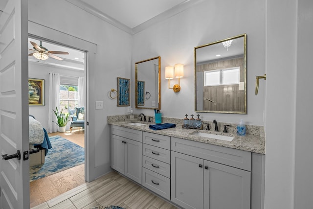 1181 Hidden Hills Cir, Greensboro, GA 30642 - ensuite bathroom featuring double vanity, a ceiling fan, ornamental molding, wood finished floors, and recessed lighting