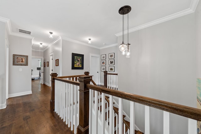 855 Jasper St, Madison, GA 30650 - hallway with an upstairs landing, dark wood-type flooring, and ornamental molding