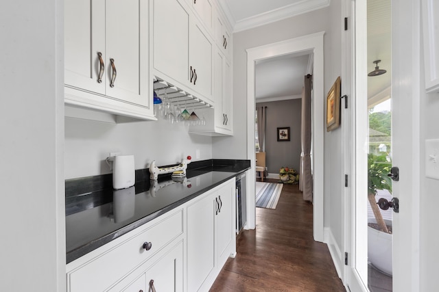 855 Jasper St, Madison, GA 30650 - kitchen featuring ornamental molding, dark countertops, white cabinetry, dark wood finished floors, and beverage cooler