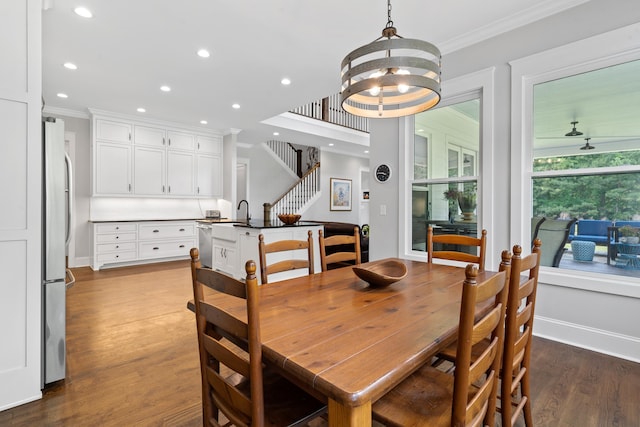 855 Jasper St, Madison, GA 30650 - dining room featuring ornamental molding, dark wood-style flooring, recessed lighting, a chandelier, and stairs