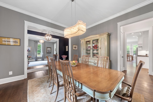 855 Jasper St, Madison, GA 30650 - dining space with crown molding, wood finished floors, and a chandelier