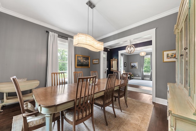 855 Jasper St, Madison, GA 30650 - dining area featuring plenty of natural light, dark wood-style flooring, crown molding, and a chandelier
