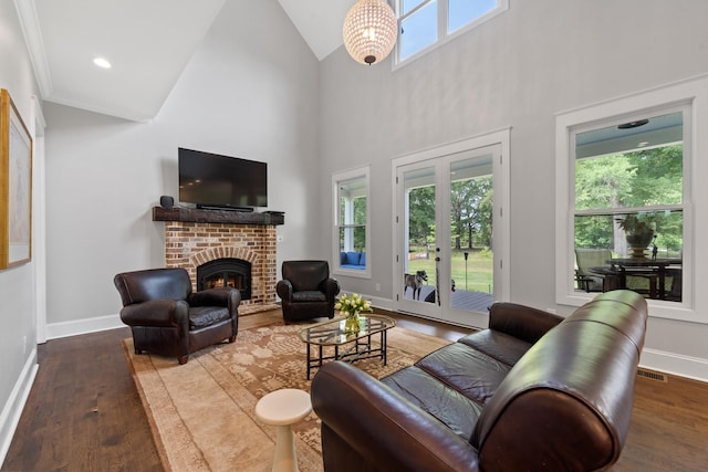 855 Jasper St, Madison, GA 30650 - living area featuring wood finished floors, a fireplace, and high vaulted ceiling