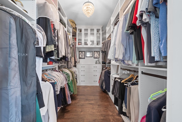 855 Jasper St, Madison, GA 30650 - walk in closet featuring wood finished floors and a chandelier