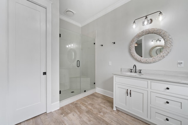 855 Jasper St, Madison, GA 30650 - bathroom with crown molding, a shower stall, vanity, and wood finished floors