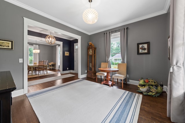 855 Jasper St, Madison, GA 30650 - sitting room with a chandelier, wood finished floors, and ornamental molding