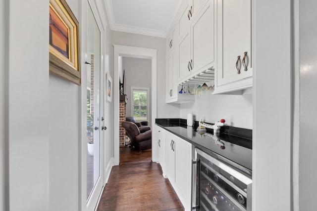 855 Jasper St, Madison, GA 30650 - indoor dry bar featuring beverage cooler, ornamental molding, and dark wood-type flooring