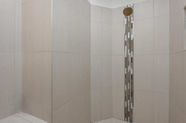 full bathroom with a tile shower