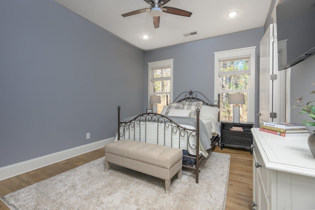 bedroom featuring visible vents, baseboards, ceiling fan, light wood-type flooring, and recessed lighting