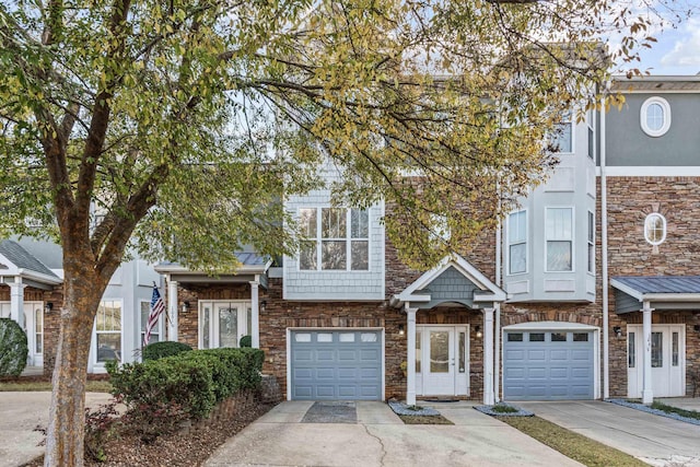 multi unit property featuring a garage