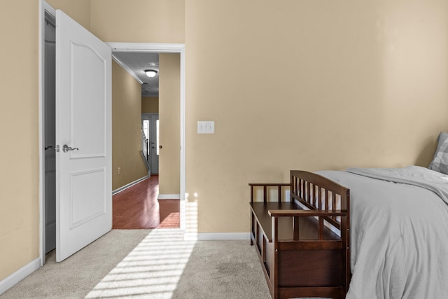 bedroom with light colored carpet