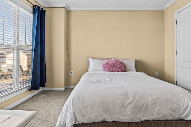 carpeted bedroom featuring ornamental molding