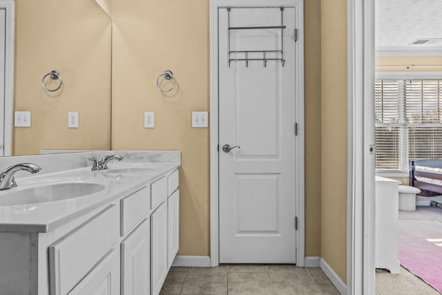 bathroom with vanity and tile patterned floors