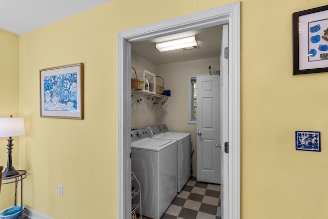 1027 Harper St, Madison, GA 30650 - laundry room featuring dark floors and washing machine and dryer