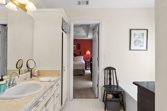 1027 Harper St, Madison, GA 30650 - full bath with vanity, tile patterned floors, a garden tub, and ensuite bathroom