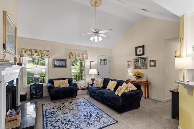 1027 Harper St, Madison, GA 30650 - carpeted living room with vaulted ceiling, ceiling fan, and a premium fireplace