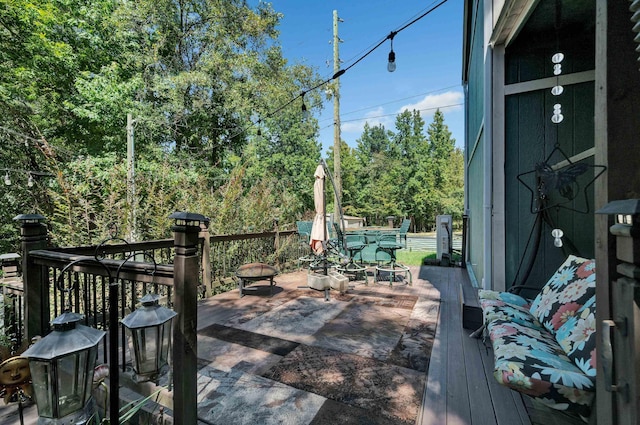 wooden deck featuring a fire pit