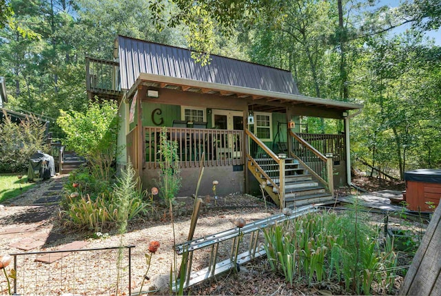 view of front of property featuring a hot tub and french doors