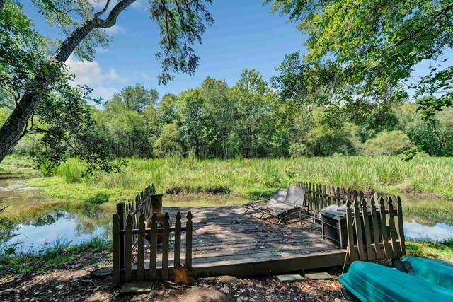 wooden deck featuring a water view