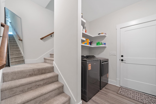 165 Hunters Chase Ct, Eatonton, GA 31024 - laundry area featuring washer and clothes dryer and wood finished floors