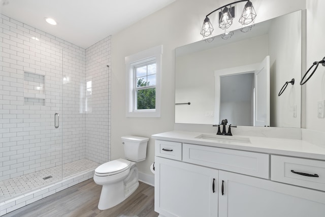 165 Hunters Chase Ct, Eatonton, GA 31024 - bathroom with a stall shower, vanity, and wood finished floors