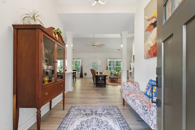165 Hunters Chase Ct, Eatonton, GA 31024 - entryway with decorative columns, wood finished floors, and a ceiling fan