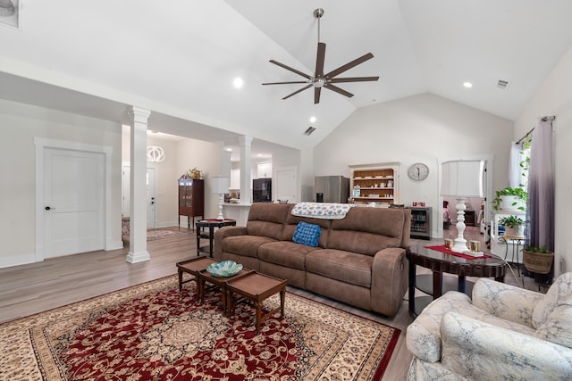 165 Hunters Chase Ct, Eatonton, GA 31024 - living room featuring decorative columns, light wood-style floors, a ceiling fan, recessed lighting, and high vaulted ceiling