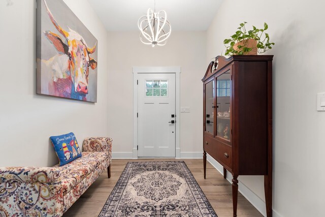 165 Hunters Chase Ct, Eatonton, GA 31024 - foyer entrance with light wood-style floors and a chandelier