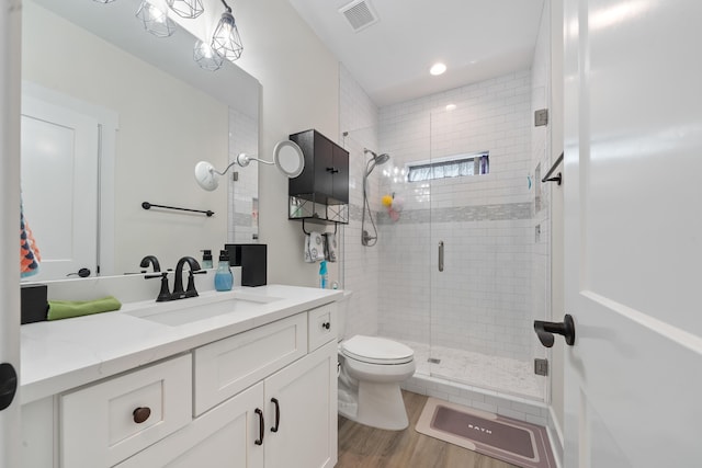 165 Hunters Chase Ct, Eatonton, GA 31024 - bathroom featuring vanity, a stall shower, wood finished floors, and recessed lighting