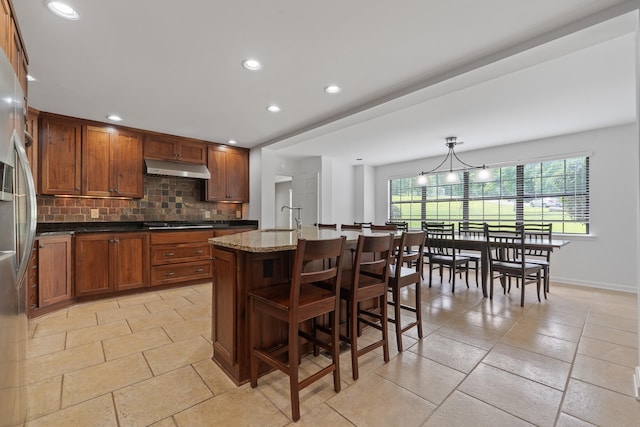 32 Lily Pt, Sparta, GA 31087 - kitchen with stainless steel appliances, tasteful backsplash, under cabinet range hood, a sink, and recessed lighting