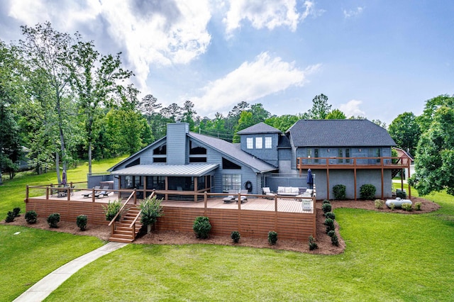 32 Lily Pt, Sparta, GA 31087 - back of house featuring a deck, a lawn, a chimney, and stairs