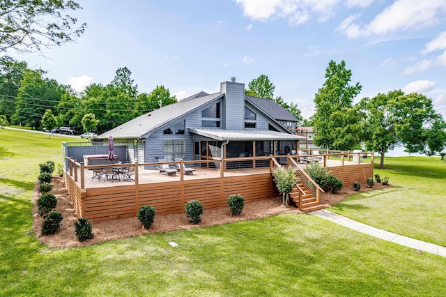 32 Lily Pt, Sparta, GA 31087 - rear view of property featuring a sunroom, a wooden deck, a chimney, and a yard