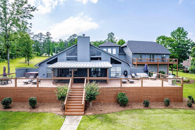 32 Lily Pt, Sparta, GA 31087 - rear view of property featuring a chimney, a yard, a standing seam roof, a deck, and stairs