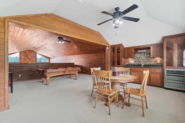 32 Lily Pt, Sparta, GA 31087 - dining room with wood walls, vaulted ceiling, ceiling fan, light colored carpet, and pool table