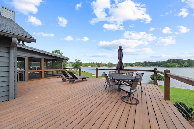 32 Lily Pt, Sparta, GA 31087 - deck featuring a water view, a sunroom, and outdoor dining area
