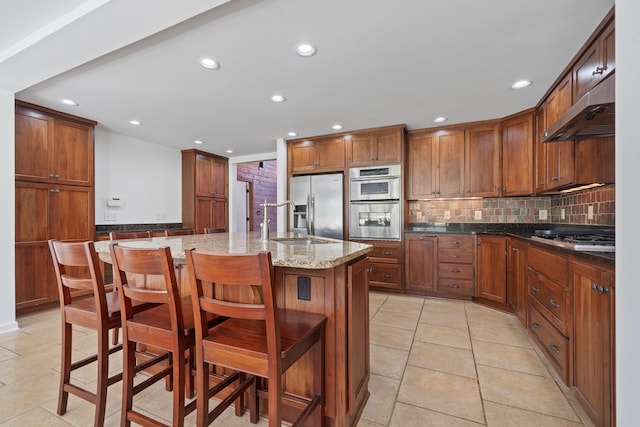 32 Lily Pt, Sparta, GA 31087 - kitchen featuring under cabinet range hood, recessed lighting, a sink, appliances with stainless steel finishes, and tasteful backsplash