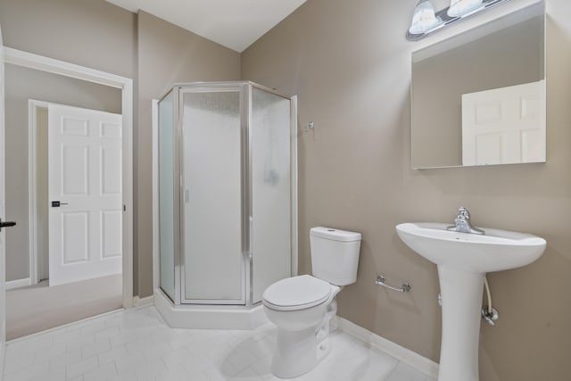 32 Lily Pt, Sparta, GA 31087 - full bathroom with a stall shower, toilet, baseboards, and tile patterned flooring