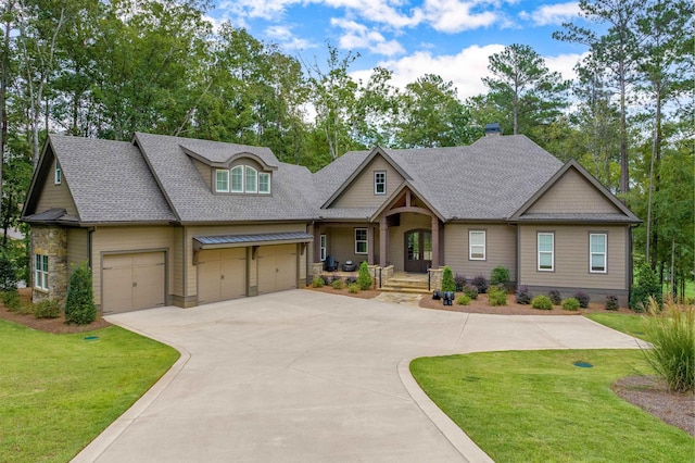 craftsman inspired home with a garage and a front lawn