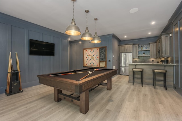 playroom with light wood-type flooring and billiards