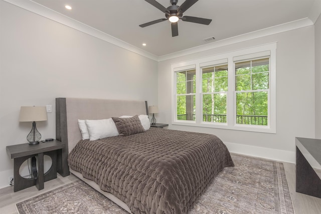 bedroom with ornamental molding and ceiling fan