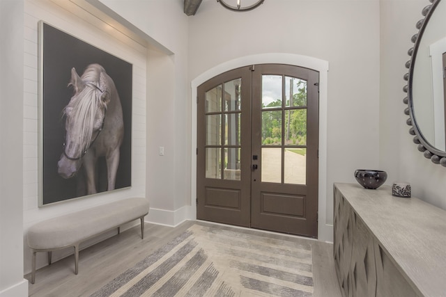 entryway featuring light hardwood / wood-style floors and french doors