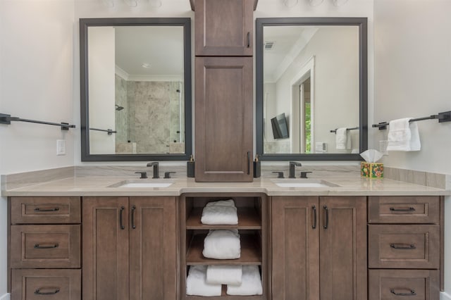 bathroom with vanity, ornamental molding, and walk in shower