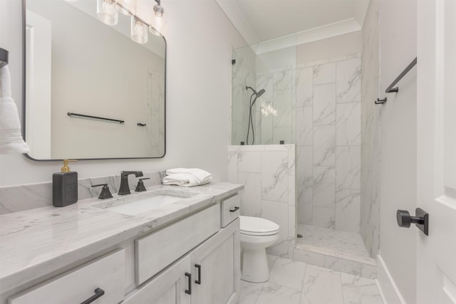 bathroom featuring vanity, ornamental molding, toilet, and tiled shower