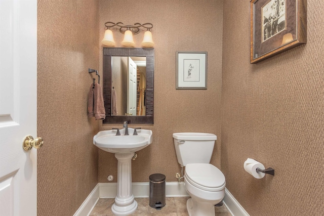 bathroom with tile patterned floors and toilet