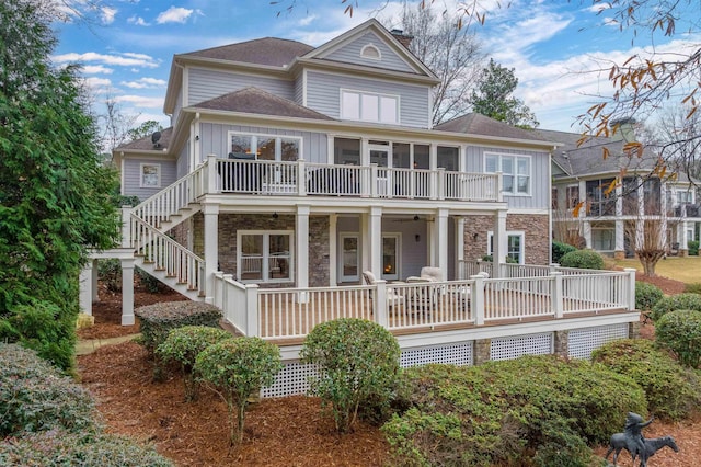 back of property featuring a balcony and covered porch