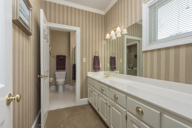 bathroom featuring vanity, ornamental molding, and toilet