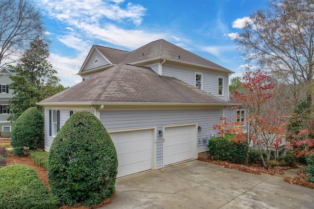 view of side of home featuring a garage