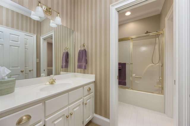 bathroom with vanity and enclosed tub / shower combo